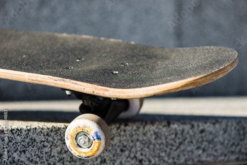 Skateboard on skate park at sunset.