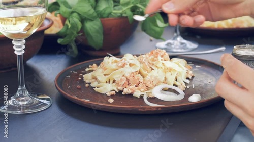 Group of young people eating traditional Italian pasta . photo