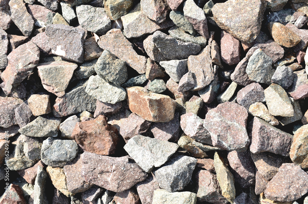 Many rocks are scattered on the floor.