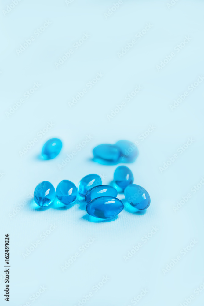 Single blue softgel capsule pill Single blue softgel capsule pill