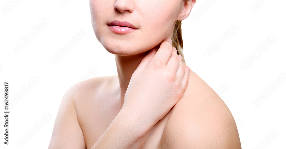 Portrait of girl with nude make-up with hand on neck isolated on white background. Girl with clean healthy skin on white. Cosmetology, medicine, beauty care. Nude makeup Portrait of girl with nude make-up with hand on neck isolated on white background. Girl with clean healthy skin on white. Cosmetology, medicine, beauty care. Nude makeup