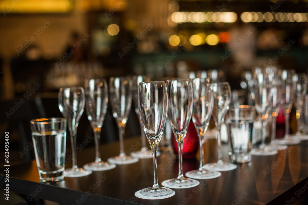 Fototapeta premium Wine glasses stand on the table, dishes.