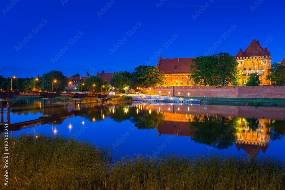 The Castle of the Teutonic Order in Malbork at night, Poland The Castle of the Teutonic Order in Malbork at night, Poland