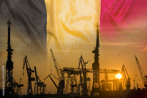 Industrial concept with Belgium flag at sunset photo