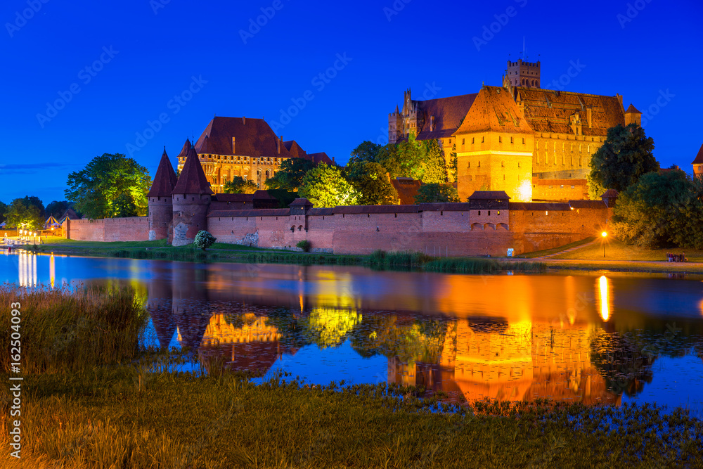 The Castle of the Teutonic Order in Malbork at night, Poland