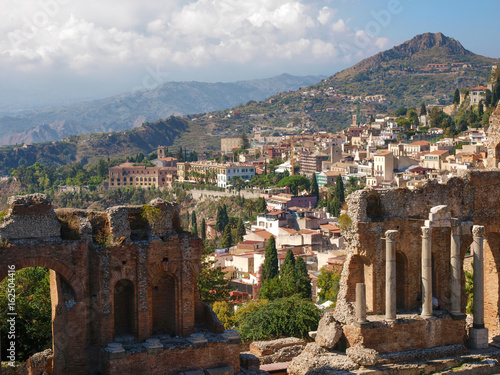 Ruins of the ancient Greek theater and view of Taormina, Sicily.