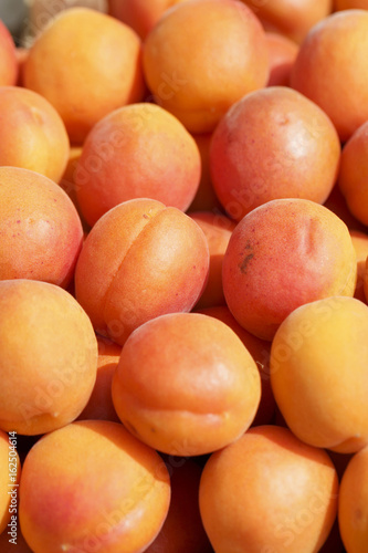 Apricots on the market, Colorful photo of apricots with defocused background, Selective focus with shallow depth of field