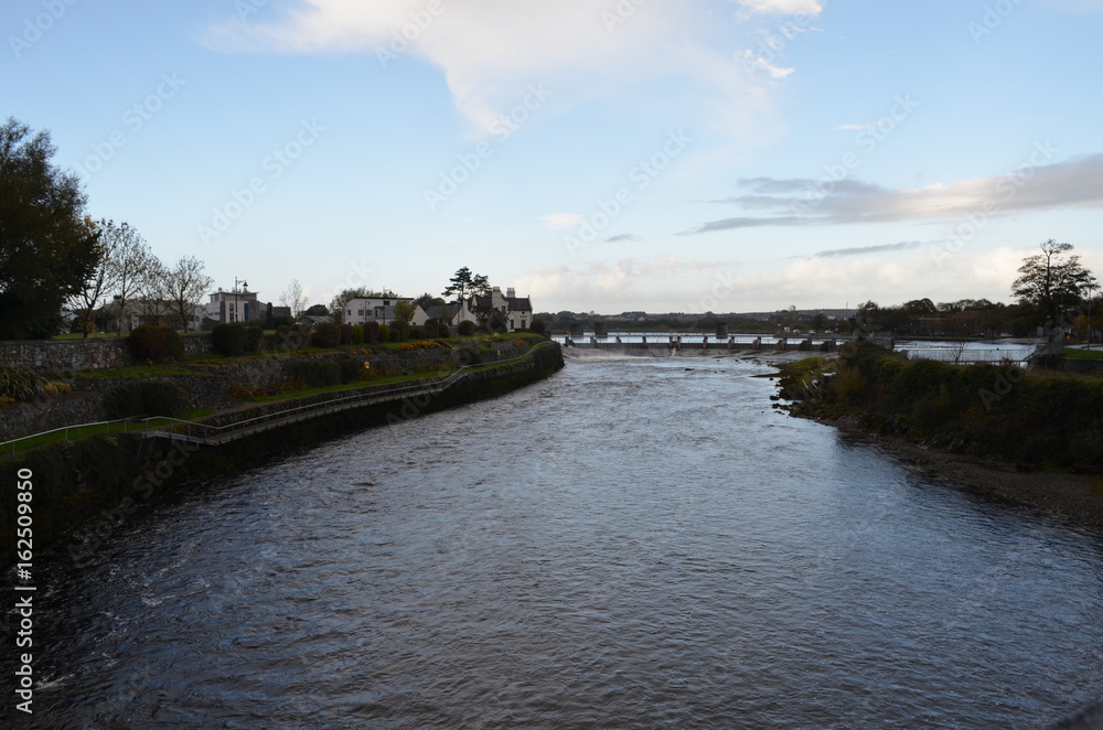 River Corrib and Dam near a Cathedral in Galway, Ireland