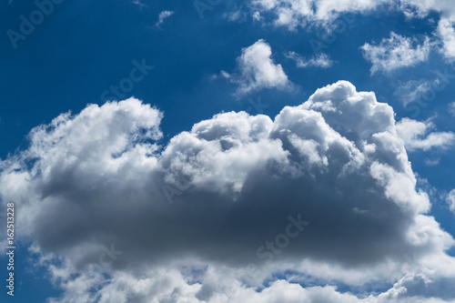 A large Cumulus cloud in the blue clear sky.