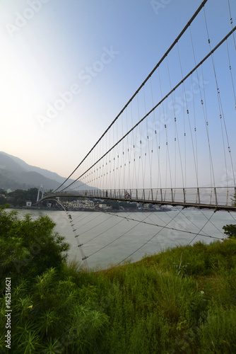 Bridge across the Ganges River in Rishikesh, India photo