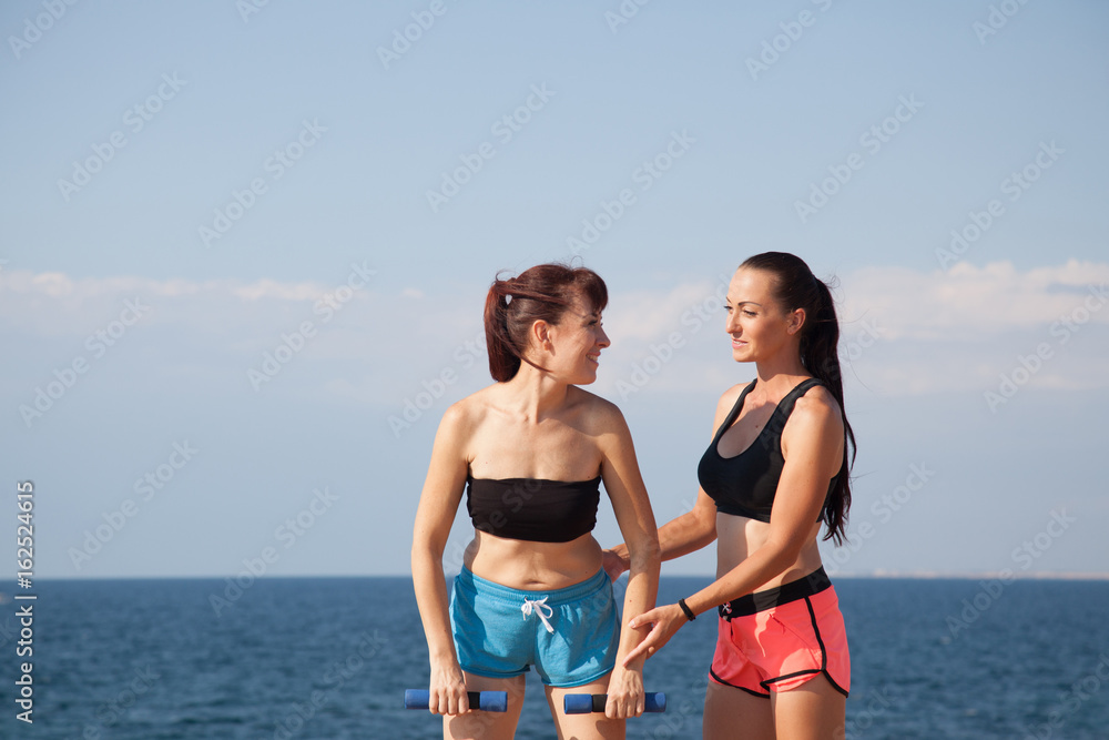 fitness instructor teaches a woman to play sports fitness instructor teaches a woman to play sports