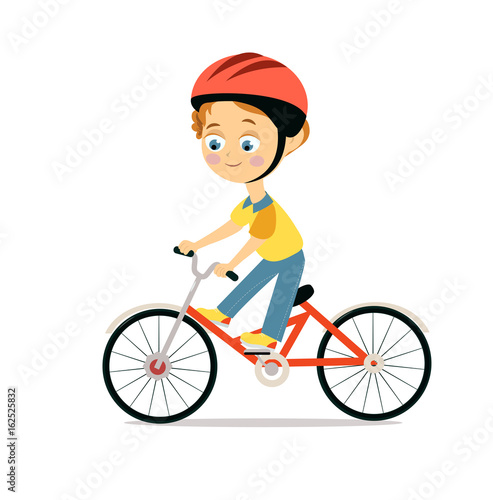 Happy little boy in helmet riding bicycle
