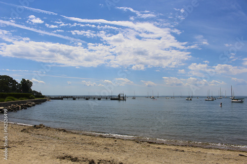 beach scene with boats and Yachts