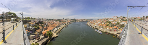 Fototapeta Naklejka Na Ścianę i Meble -  Panoramic view of Porto Ribeira cityscape from top of Luis I Bridge