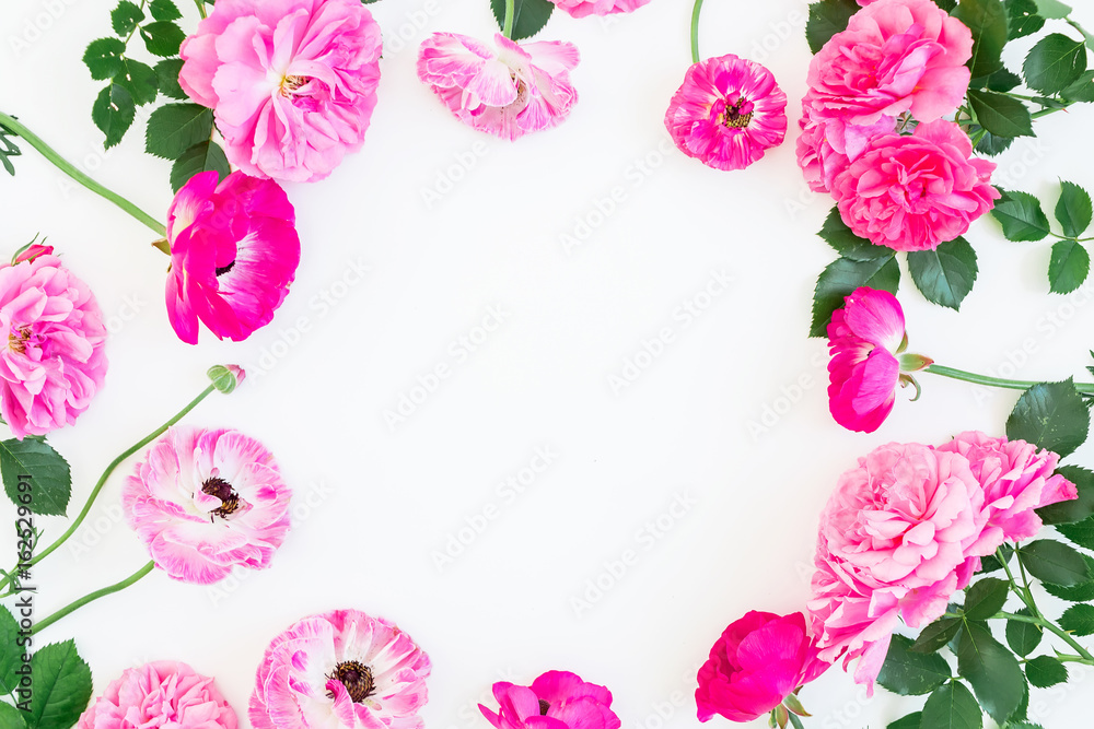 Floral frame made of pink roses, peonies and leaves on white background. Flat lay, top view. Floral lifestyle composition.