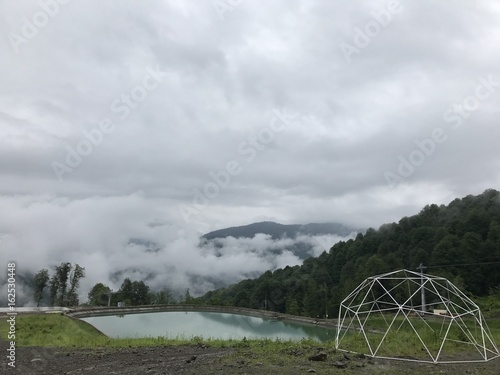 Lake in the mountains and some kind of thing