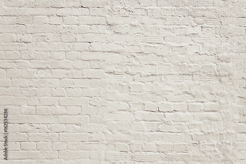 Old white painted brick wall background texture