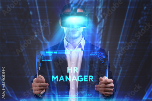 Business, Technology, Internet and network concept. Young businessman working in virtual reality glasses sees the inscription: HR manager