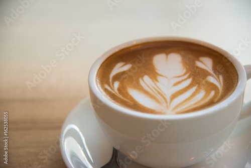 Cup of coffee with beautiful Latte art.how to make latte art coffee