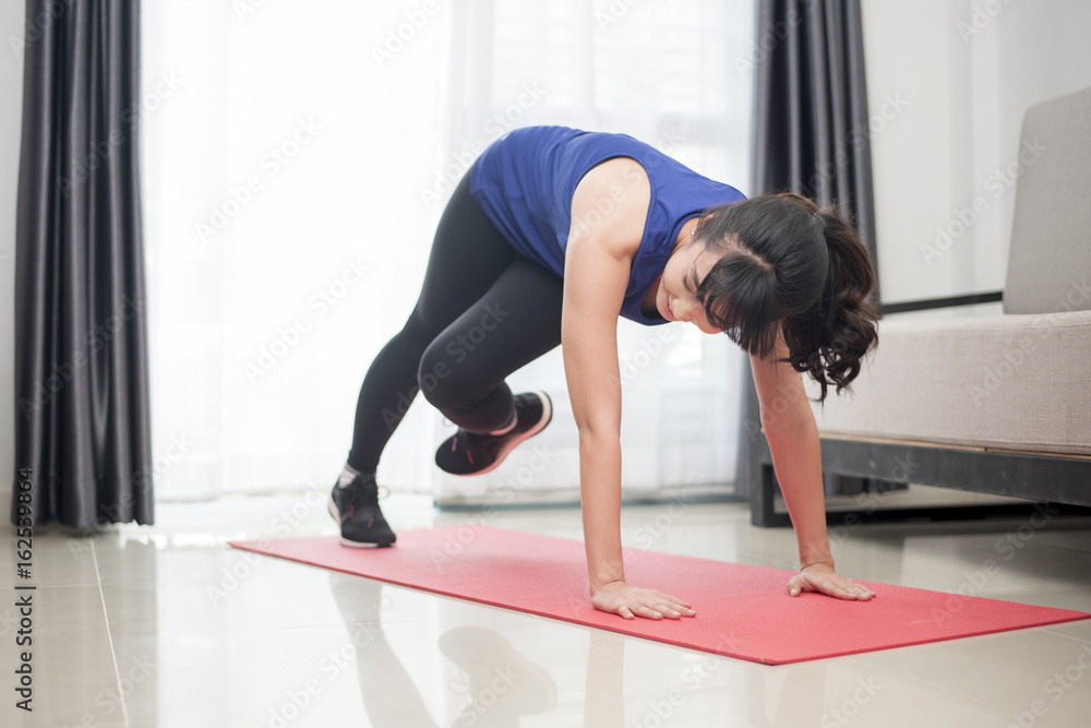 Beautiful Young sporty woman pushing up at home ,Mountain climber Beautiful Young sporty woman pushing up at home ,Mountain climber