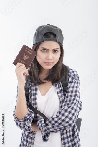 Beautiful travel girl with Thailand passport isolated on white background