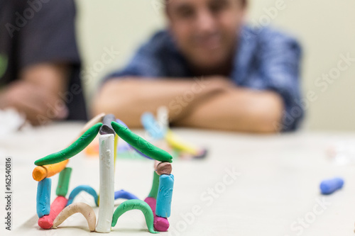 colored house made of play dough.