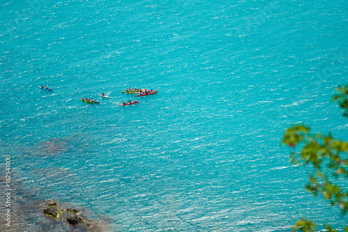 Top view of kayak boat oin shallow turquoise water