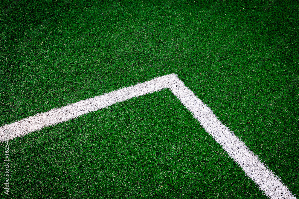 Obraz premium Corner(White stripe) on the green soccer field - background
