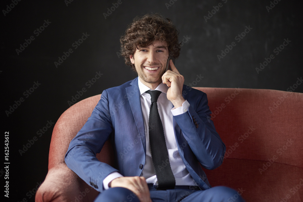 Young professional man using his cellphone Young professional man using his cellphone