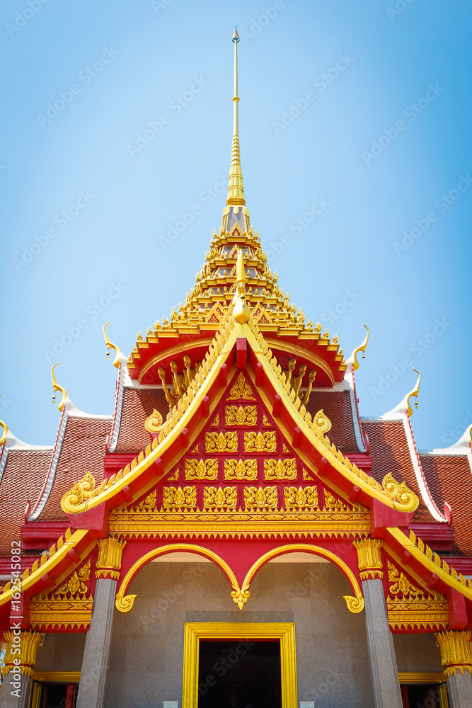 Part of Thai temple roof with blue sky background