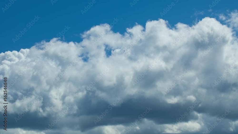 Clouds time lapse. White fluffy clouds float beautiful and foam on the blue sky. Clouds time lapse. White fluffy clouds float beautiful and foam on the blue sky.
