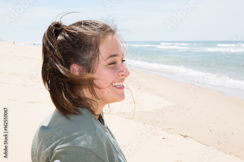 smiling young girl in summer beach