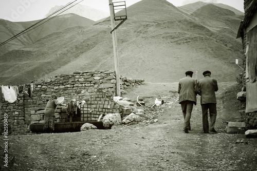 Two men walking in Xinaliq, village of Azerbaijan