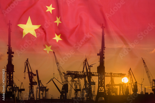 Photography Industrial concept with China flag at sunset