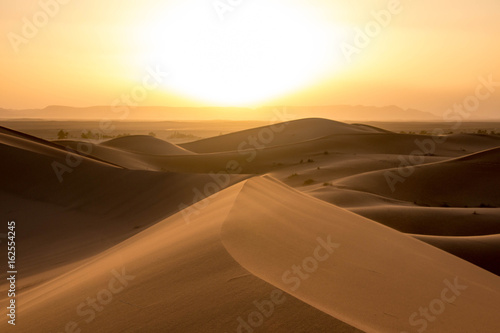 Fototapeta Naklejka Na Ścianę i Meble -  Sunrise in the Sahara Desert at Erg Chebbi, Morocco