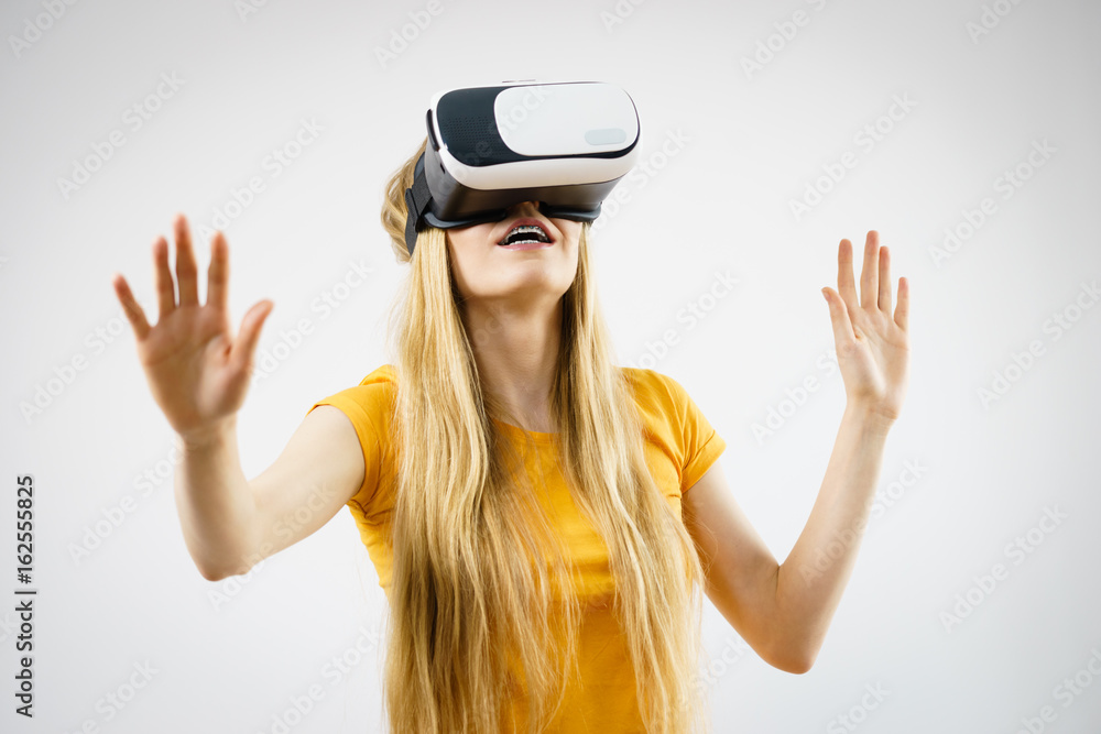 Girl wearing virtual reality goggles. Girl wearing virtual reality goggles.