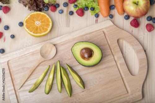 Avocado on wood table ,Healthy food concept