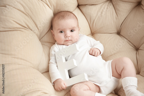Cute baby with letter E lyi...