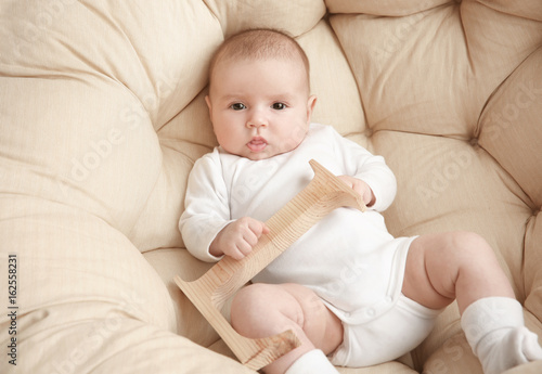 Cute baby with letter L lyi...