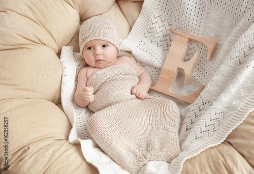 Cute baby with letter E lyi...