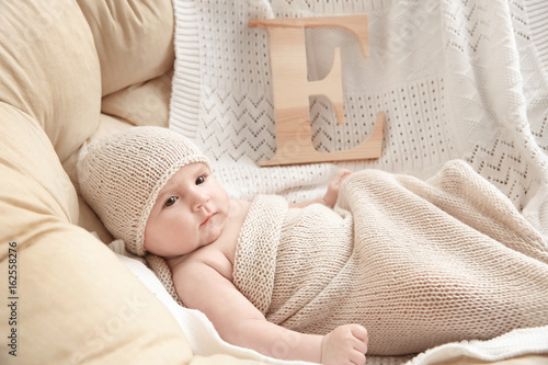 Cute baby with letter E lyi...