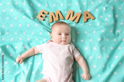 Cute baby with word EMMA ly...