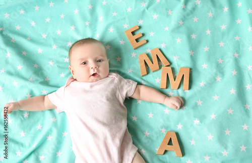Cute baby with word EMMA ly...