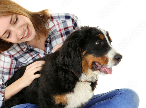 Young woman with cute funny dog on white background