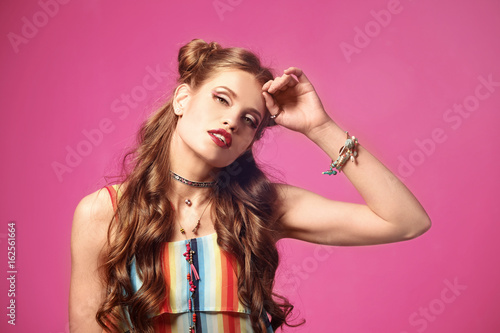 Beautiful stylish woman on color background