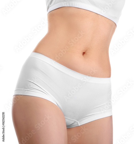 Beautiful young woman in underwear on white background, closeup. Diet concept