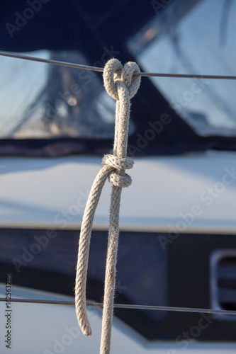 Rope tied to the railing on the boat a clove hitch