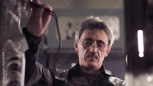 Man working with electric tools.