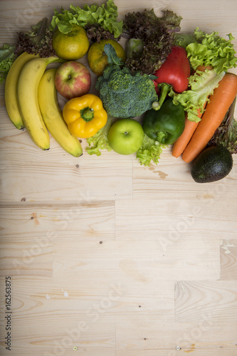 Vegetables and fruits on wood table  Healthy food concept