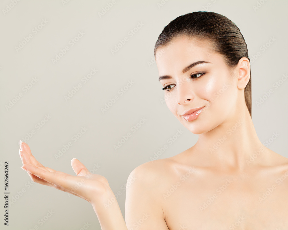 Young Beautiful Woman Looking at her Empty Hand Young Beautiful Woman Looking at her Empty Hand